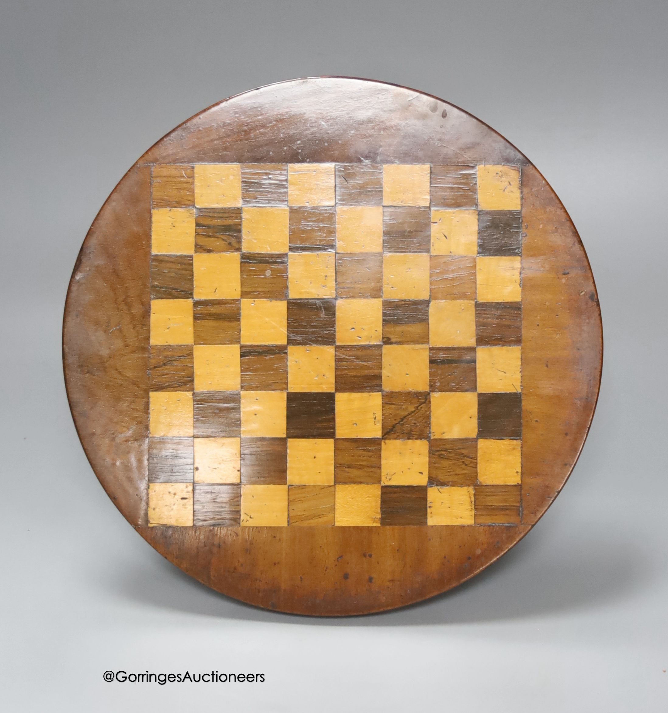 An Apprentice made miniature mahogany, rosewood and satiwnood tilt top games table, diameter 27cm